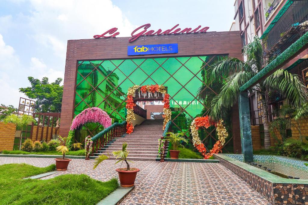 a entrance to a building with a sign that reads a garden at FabExpress Le Gardenia in Patna