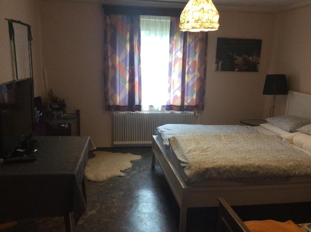 Postel nebo postele na pokoji v ubytování Mooswirt