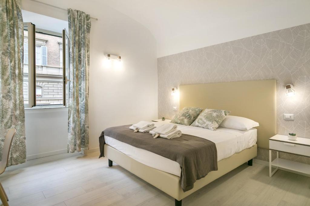 Posteľ alebo postele v izbe v ubytovaní White Candia Guesthouse