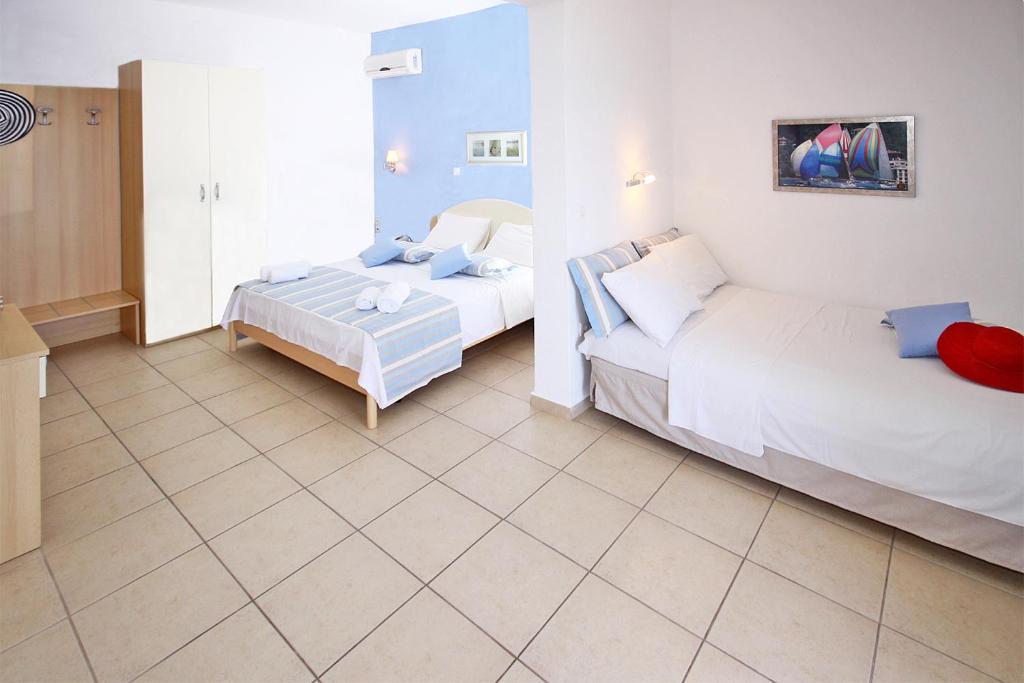 Postel nebo postele na pokoji v ubytování Miramare Hotel
