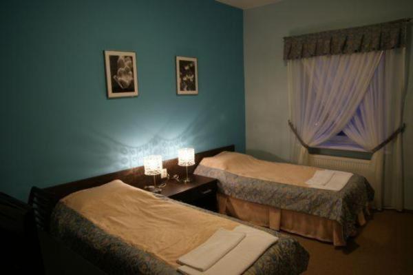Tempat tidur dalam kamar di Hotel Chrobry