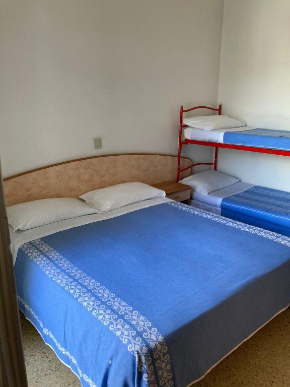 Postel nebo postele na pokoji v ubytování Hotel Villa Sorci