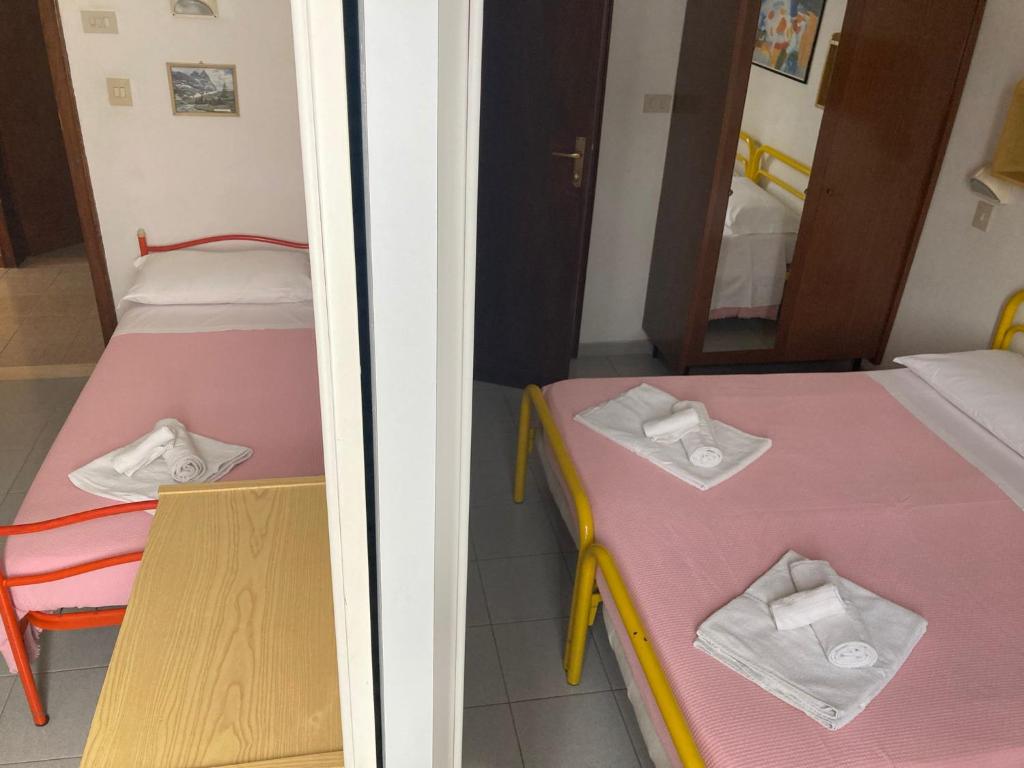 Postel nebo postele na pokoji v ubytování Hotel Villa Sorci
