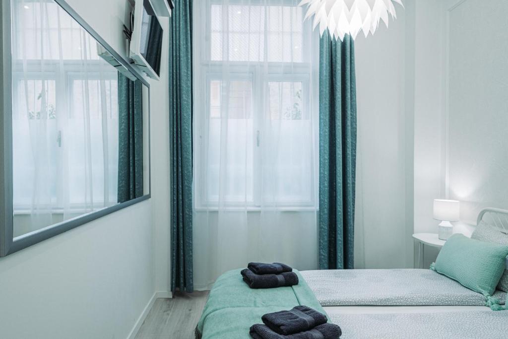Postel nebo postele na pokoji v ubytování Budapest Holidays Harmony