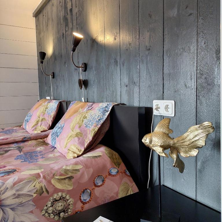 Postel nebo postele na pokoji v ubytování B&B in de Dorpsstraat