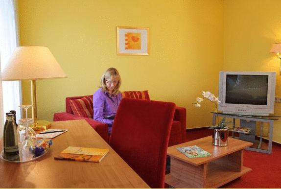 TV a/nebo společenská místnost v ubytování Hotel Bertram