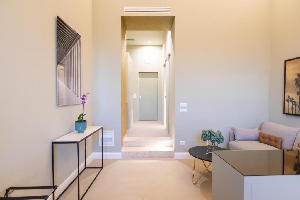 Televízia a/alebo spoločenská miestnosť v ubytovaní Domus 21 Luxury Suites
