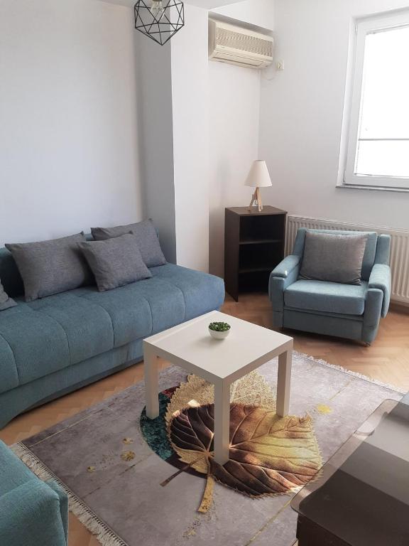 a living room with a couch and a table at IV2020 apartment in Skopje