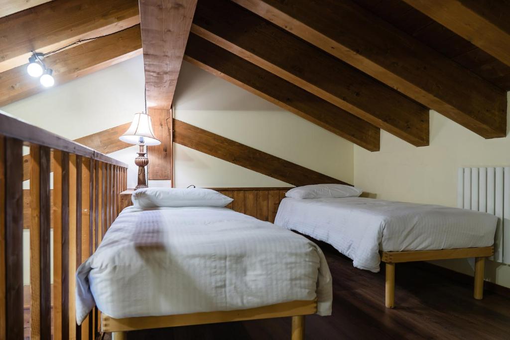 Letto o letti in una camera di Chalet du Lys Hotel & SPA