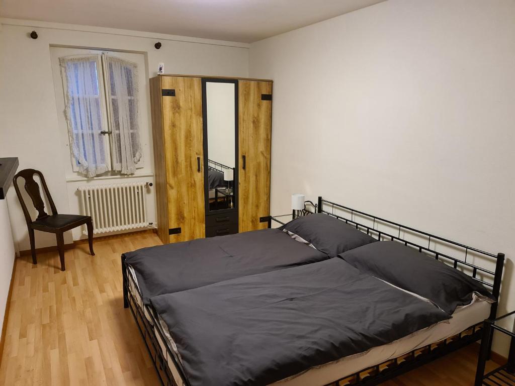 Postel nebo postele na pokoji v ubytování Auberge de Ballens