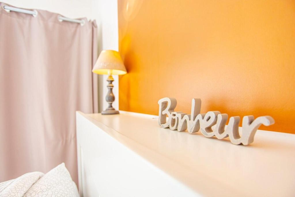 Postel nebo postele na pokoji v ubytování L'Aparté HYPER CENTRE LUMINEUX