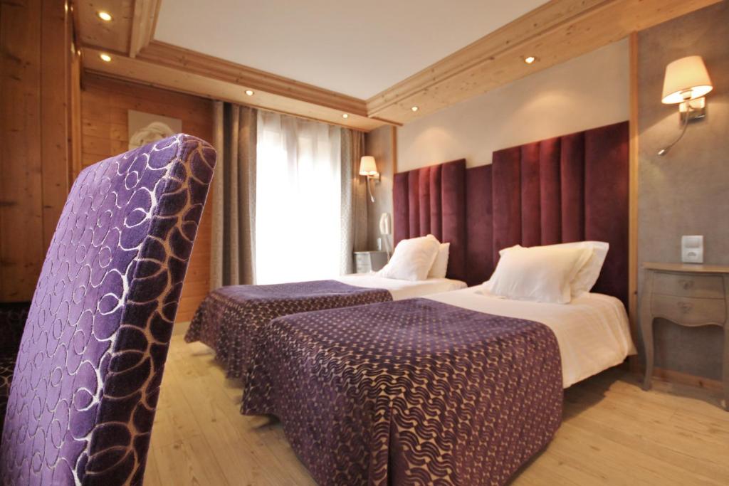 Postel nebo postele na pokoji v ubytování Hôtel Alpina & SPA - Restaurant Oxalis