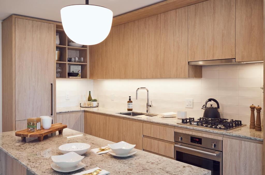 a kitchen with wooden cabinets and a counter top at Level Chicago - River North in Chicago