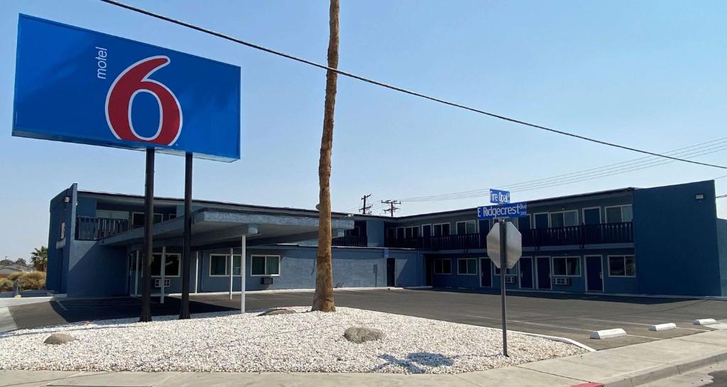 a building with a sign in front of it at Motel 6 Ridgecrest, CA China Lake in Ridgecrest