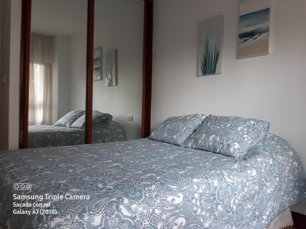 Cama o camas de una habitación en Apartamentos Virita Coqueto Apartamento vacacional, próximo a la playa