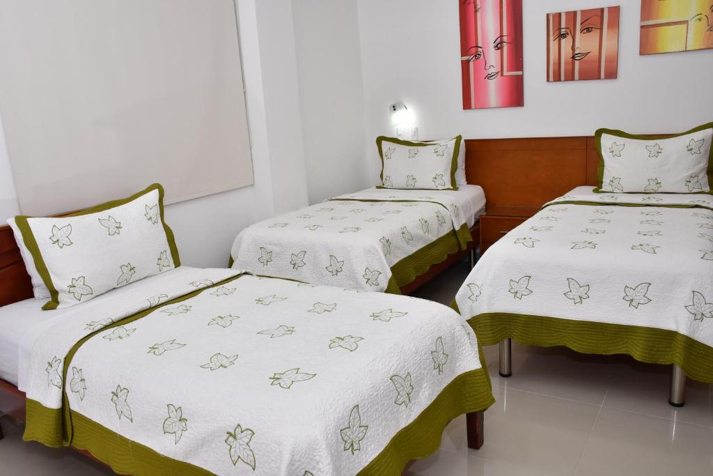 Postel nebo postele na pokoji v ubytování Hotel B`Quin Plaza Cúcuta