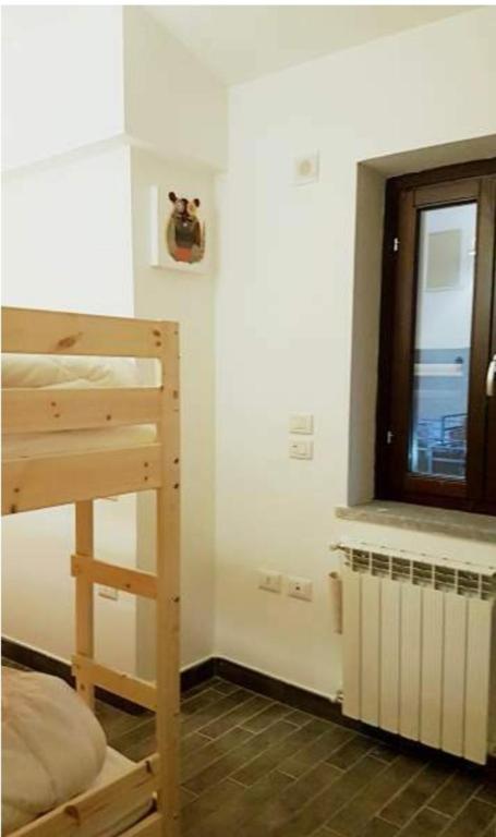 Łóżko lub łóżka w pokoju w obiekcie La casa di Olivia