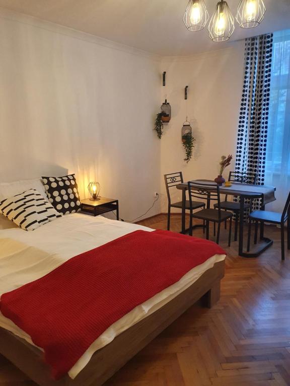 Postel nebo postele na pokoji v ubytování Moti Apartments