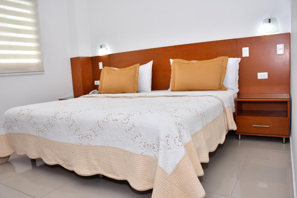 Postel nebo postele na pokoji v ubytování Hotel B`Quin Plaza Cúcuta