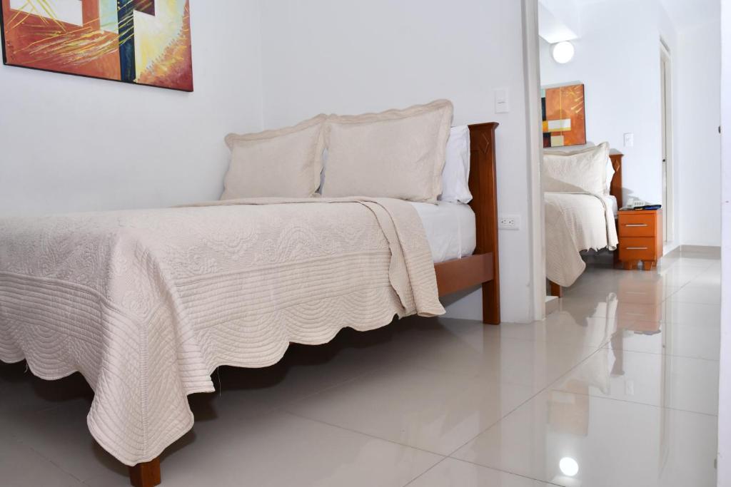 Postel nebo postele na pokoji v ubytování Hotel B`Quin Plaza Cúcuta