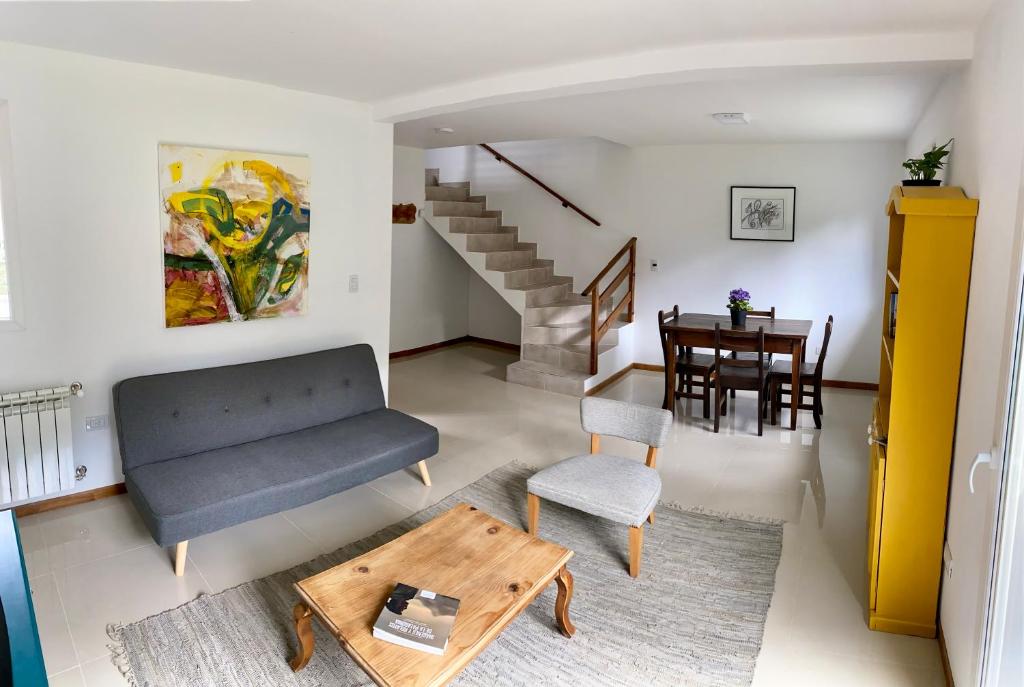 a living room with a couch and a table at Terrazas de la Patagonia in Esquel