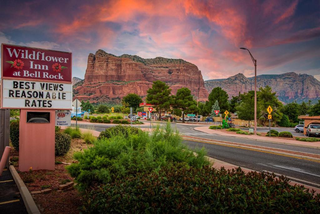 a sign on the side of a road in front of a mountain at Wildflower Inn at Bell Rock in Sedona