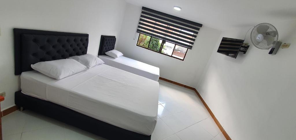 Postel nebo postele na pokoji v ubytování Hotel Picasso 70