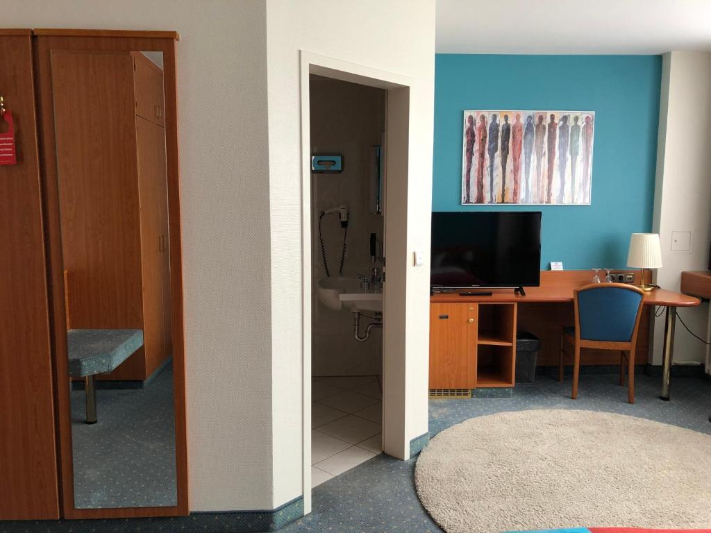 TV a/nebo společenská místnost v ubytování Hotel Servatius
