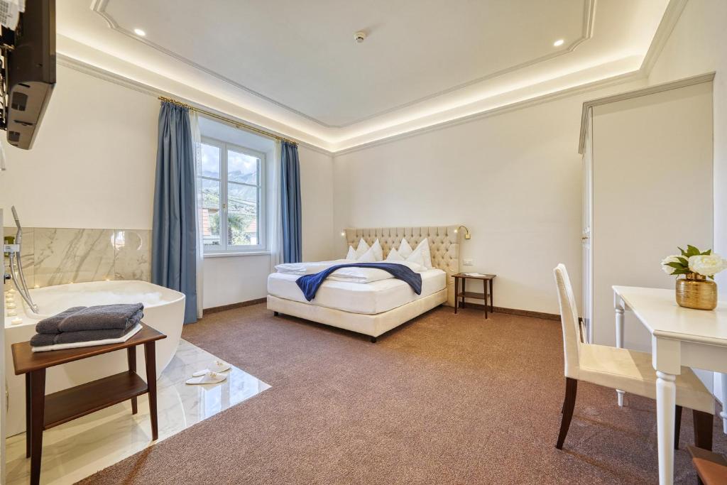 Postel nebo postele na pokoji v ubytování Villa Tell rooms and suites