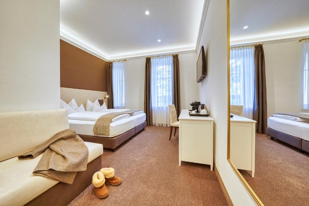 Postel nebo postele na pokoji v ubytování Villa Tell rooms and suites