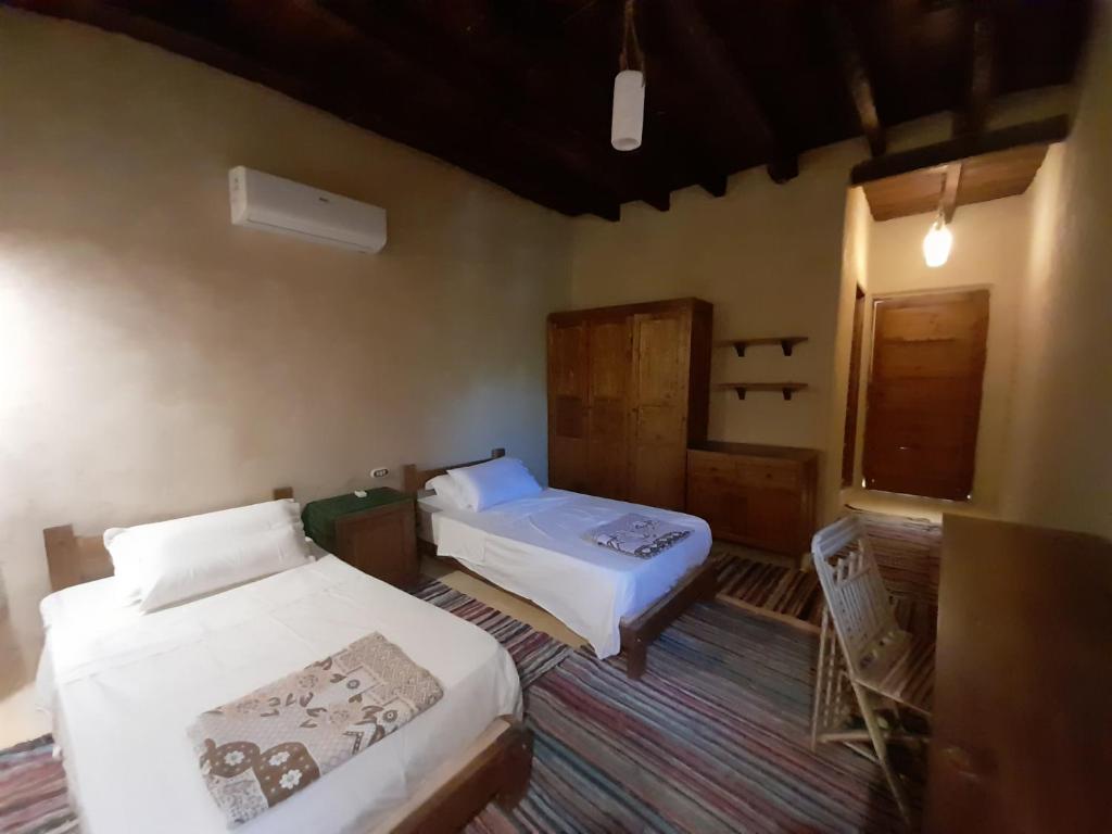 Postel nebo postele na pokoji v ubytování Sleep In Siwa