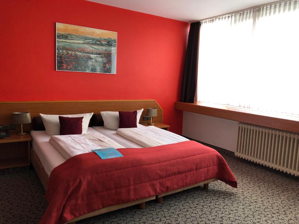 Postel nebo postele na pokoji v ubytování Hotel Servatius
