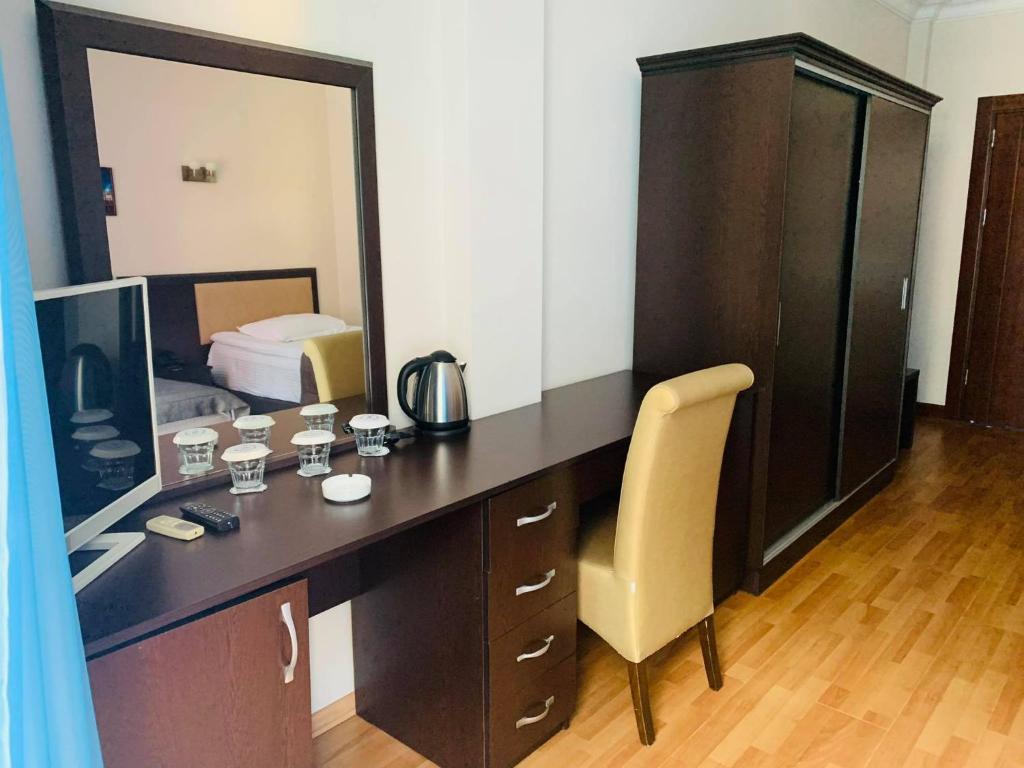 Postel nebo postele na pokoji v ubytování Hotel Neptun Kvariati