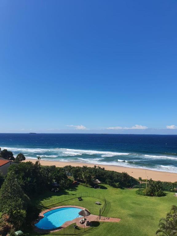 an aerial view of a beach and a swimming pool at 9 Kyalanga Beach in Durban