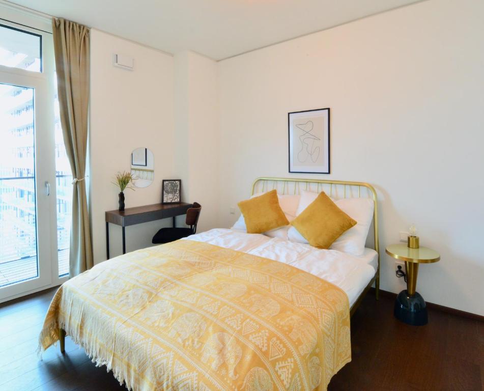 a bedroom with a bed and a window at Brand-New, Close to Centre, Rooftop-Summer-Pool in Vienna