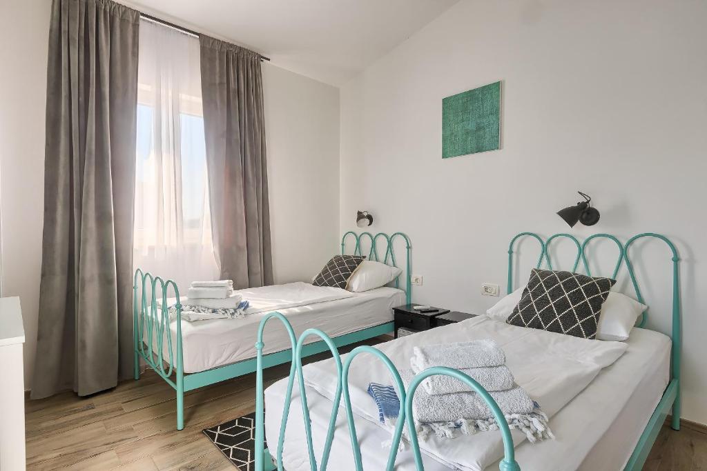 Postel nebo postele na pokoji v ubytování Villa Tea