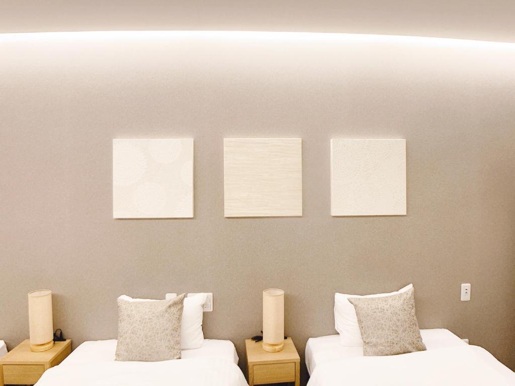 Postel nebo postele na pokoji v ubytování HOTEL CLA-SS HIROSHIMA-TOKAICHI