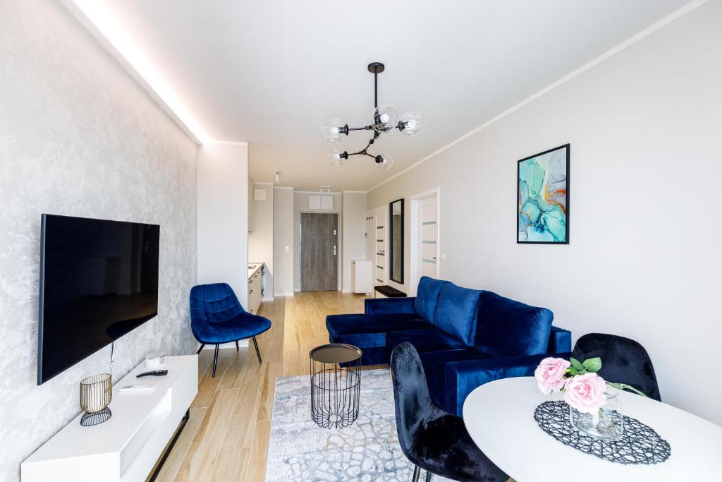 Televízia a/alebo spoločenská miestnosť v ubytovaní Balticus Apartamenty Deluxe Promenada Gwiazd 14