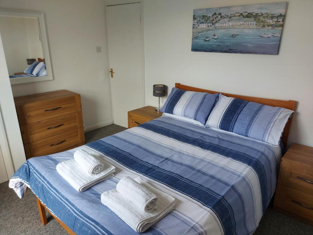 Postel nebo postele na pokoji v ubytování Summerhill Apartments