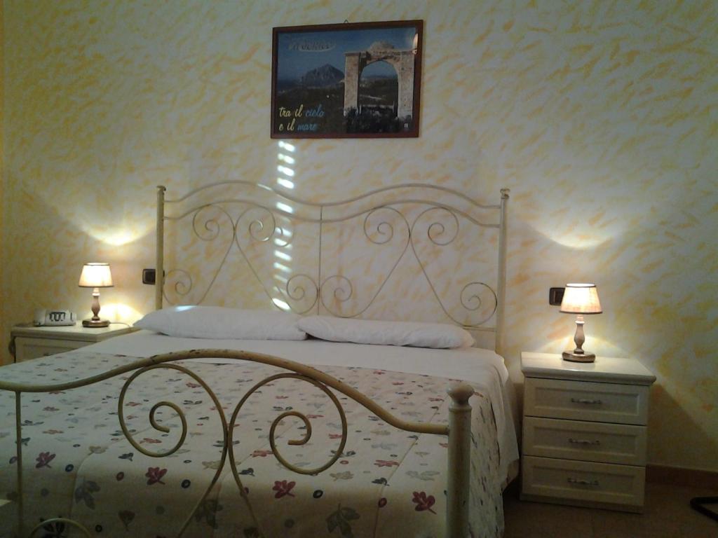Postel nebo postele na pokoji v ubytování History Hotel