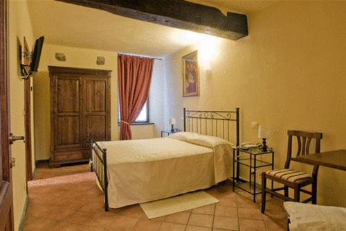 En eller flere senger på et rom på La Campana D'Oro