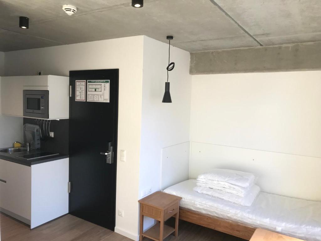 Kuchyň nebo kuchyňský kout v ubytování SITE.INN Hamburg