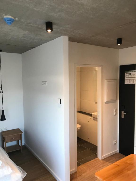 Postel nebo postele na pokoji v ubytování SITE.INN Hamburg