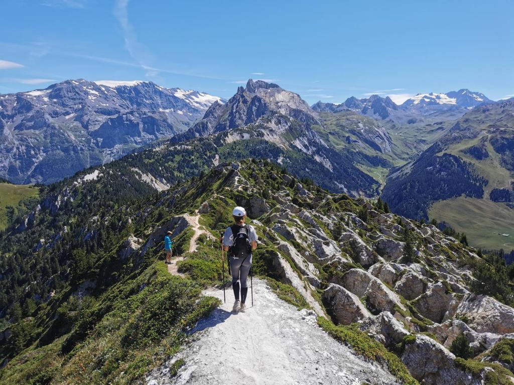 a man riding a bike on a mountain trail at Chalet Emilie in Courchevel