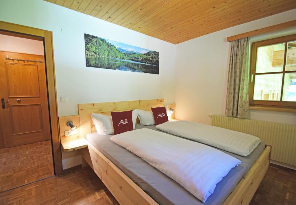 Postel nebo postele na pokoji v ubytování Alpboden