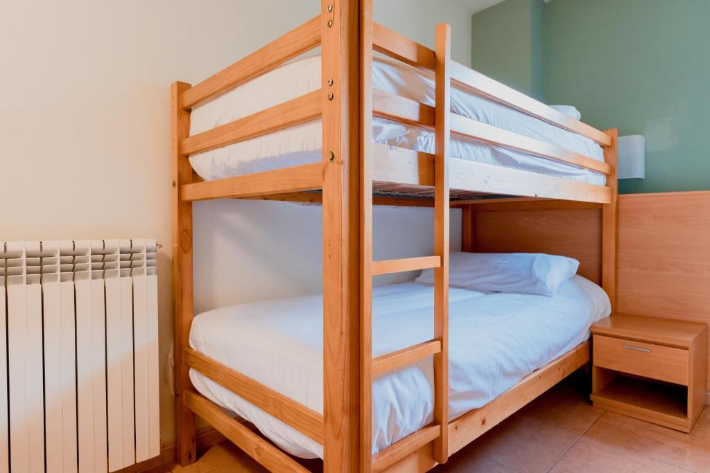 Postel nebo postele na pokoji v ubytování Pierre & Vacances Aparthotel La Tulipa