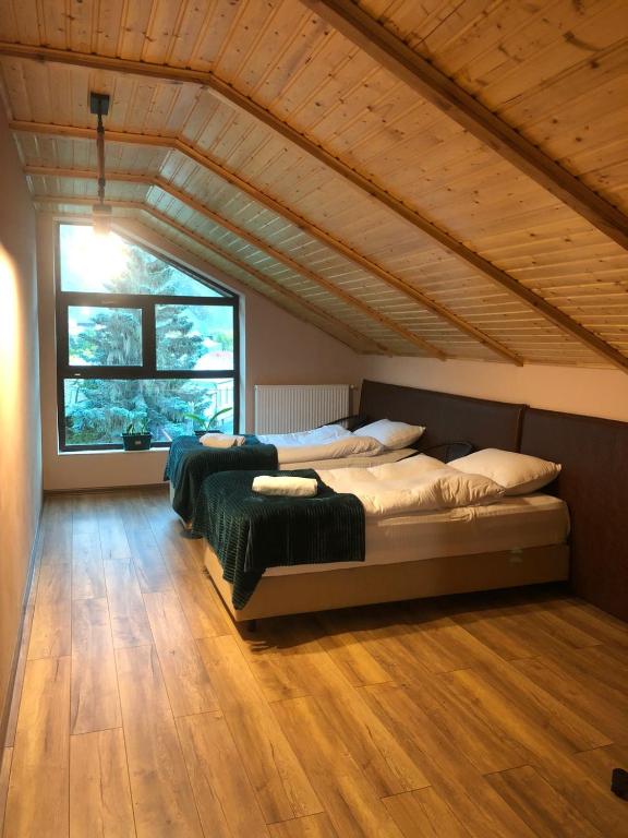 A bed or beds in a room at Paramount Kazbegi