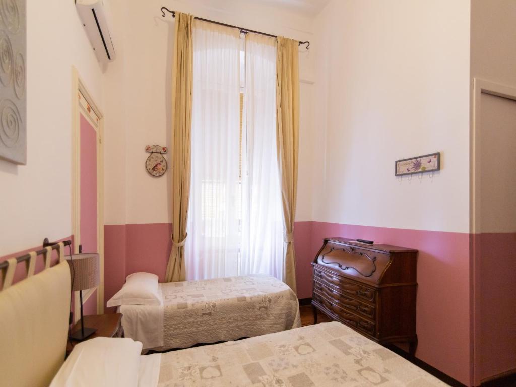 Postel nebo postele na pokoji v ubytování Hotel Portofino
