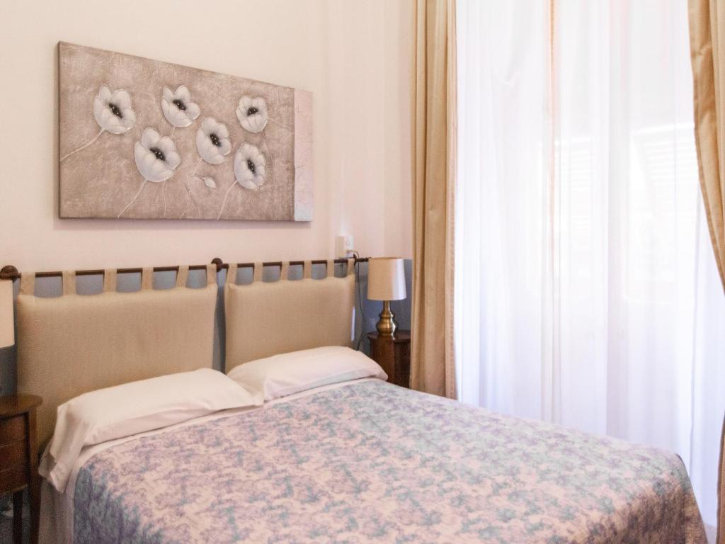 Postel nebo postele na pokoji v ubytování Hotel Portofino