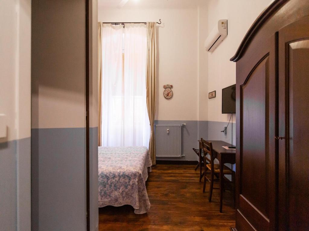 Postel nebo postele na pokoji v ubytování Hotel Portofino